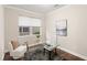 Cozy office space filled with natural light with a decorative rug and glass desk at 10713 Berry Creek Rd, Orlando, FL 32836