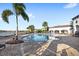 Resort-style pool with lounge chairs and lake views at 10713 Berry Creek Rd, Orlando, FL 32836