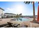 Relaxing pool area with lounge chairs and palm trees at 10713 Berry Creek Rd, Orlando, FL 32836
