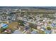 Aerial view of a residential neighborhood with houses, landscaping, and a pool at 3342 Kaleigh Ct, Saint Cloud, FL 34772