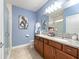 Elegant bathroom with granite vanity, tiled shower, and updated fixtures at 3570 Southern Cross Loop, Kissimmee, FL 34744
