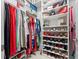 Walk-in closet with ample shelving and hanging space for clothes and shoes at 3570 Southern Cross Loop, Kissimmee, FL 34744
