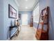 Bright and airy entryway with tiled floors and decorative shelving at 3570 Southern Cross Loop, Kissimmee, FL 34744