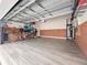 Spacious garage with epoxy flooring, storage shelving, and room for bikes at 3570 Southern Cross Loop, Kissimmee, FL 34744