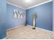 Empty spare room with light blue walls and tile floors at 3570 Southern Cross Loop, Kissimmee, FL 34744