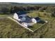 Aerial view of house, pool, and detached garage at 3705 Ridge Run Dr, Minneola, FL 34715