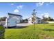 Spacious backyard with large detached garage and grassy area at 3705 Ridge Run Dr, Minneola, FL 34715