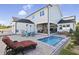 Gorgeous backyard area with a pool, patio, outdoor furniture, and a cozy lounge area at 3705 Ridge Run Dr, Minneola, FL 34715