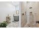 Bathroom featuring modern fixtures and tiled walk-in shower at 3705 Ridge Run Dr, Minneola, FL 34715
