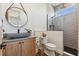 Stylish bathroom with stone sink, tiled shower, and modern fixtures at 3705 Ridge Run Dr, Minneola, FL 34715