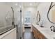 Modern bathroom with glass shower, dual vanity, and sleek fixtures at 3705 Ridge Run Dr, Minneola, FL 34715