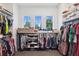 Organized walk-in closet with ample shelving, hanging rods, and natural light at 3705 Ridge Run Dr, Minneola, FL 34715