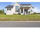 Charming two-story home with front lawn and minimalist landscaping, with sidewalk and street at 3705 Ridge Run Dr, Minneola, FL 34715
