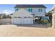 View of the house, garage, and brick-paved driveway from the side angle at 3705 Ridge Run Dr, Minneola, FL 34715
