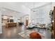 Open-concept living room featuring soaring ceilings, modern decor, and abundant natural light at 3705 Ridge Run Dr, Minneola, FL 34715