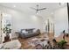 Open living room with hardwood floors, ceiling fan and ample natural light at 3705 Ridge Run Dr, Minneola, FL 34715