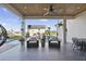 Covered patio with outdoor seating, heaters, and a view of the pool and backyard at 3705 Ridge Run Dr, Minneola, FL 34715