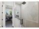 Contemporary shower with gray patterned tiles and sleek, frameless glass enclosure at 3705 Ridge Run Dr, Minneola, FL 34715