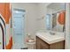 Updated bathroom with a shower/tub combo and modern vanity at 4213 Seybold Ave, Orlando, FL 32808