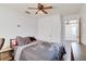 Bedroom with ceiling fan, double bed and a desk at 4213 Seybold Ave, Orlando, FL 32808