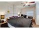 Cozy bedroom with a queen bed and built-in shelving at 4213 Seybold Ave, Orlando, FL 32808