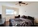 Spacious bedroom with a large bed, desk and window at 4213 Seybold Ave, Orlando, FL 32808