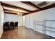 Bright dining room with wood floors, chandelier, and wood beams at 4213 Seybold Ave, Orlando, FL 32808