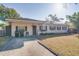 Brick ranch home with a spacious yard and driveway at 4213 Seybold Ave, Orlando, FL 32808