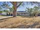 Large tree shades the front of this ranch style house at 4213 Seybold Ave, Orlando, FL 32808