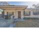 House front view, showcasing the front door and porch at 4213 Seybold Ave, Orlando, FL 32808