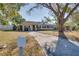 Ranch home with a long driveway and mailbox at 4213 Seybold Ave, Orlando, FL 32808