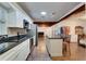 Kitchen boasts granite countertops and stainless steel appliances at 4213 Seybold Ave, Orlando, FL 32808