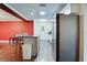 Kitchen features granite island and stainless steel fridge at 4213 Seybold Ave, Orlando, FL 32808