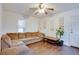 Simple living room with hardwood floors and a brown couch at 4213 Seybold Ave, Orlando, FL 32808