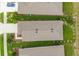 Bird's eye view of the house showcasing the roof and yard in a quiet neighborhood at 7836 June Ln, Wildwood, FL 34785