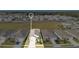 Aerial view of a single-Gathering home on a manicured lot in a neighborhood setting at 7836 June Ln, Wildwood, FL 34785