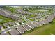 A planned community viewed from above, showing many single-Gathering homes at 7836 June Ln, Wildwood, FL 34785