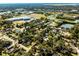 Neighborhood overview featuring numerous houses and a school in the distance at 825 Kottle S Cir, Daytona Beach, FL 32114