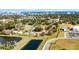Wide aerial showcasing the home's neighborhood, near water and city skyline at 825 Kottle S Cir, Daytona Beach, FL 32114