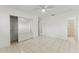 Bedroom with tile floors, ceiling fan, and mirrored closet at 825 Kottle S Cir, Daytona Beach, FL 32114