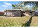 Brick home with screened patio and backyard at 825 Kottle S Cir, Daytona Beach, FL 32114