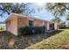 Brick house with a large yard and mature trees at 825 Kottle S Cir, Daytona Beach, FL 32114