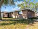 Brick home with screened patio and backyard at 825 Kottle S Cir, Daytona Beach, FL 32114