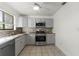 Updated kitchen, featuring stainless steel appliances and grey cabinets at 825 Kottle S Cir, Daytona Beach, FL 32114