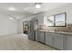 Kitchen with stainless steel appliances and gray cabinets at 825 Kottle S Cir, Daytona Beach, FL 32114