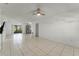 Spacious living room featuring tile floors and a ceiling fan at 825 Kottle S Cir, Daytona Beach, FL 32114