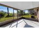 Spacious screened porch overlooking the backyard at 825 Kottle S Cir, Daytona Beach, FL 32114