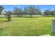 Grass backyard with a privacy fence at 10951 Savannah Landing Cir, Orlando, FL 32832