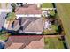 Aerial view of the property showcasing the backyard patio and outdoor entertainment area at 1219 Verdant Glade Pl, Winter Park, FL 32792