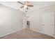 Bedroom with neutral walls, carpet and a view of the hallway and bathroom at 1219 Verdant Glade Pl, Winter Park, FL 32792